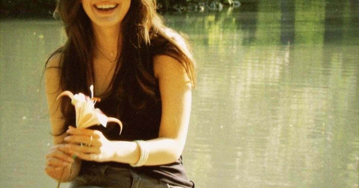 smilling girl holding flowers
